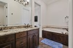 Ensuite with double vanity, walk-in shower, large walk-in closet & jetted lub
